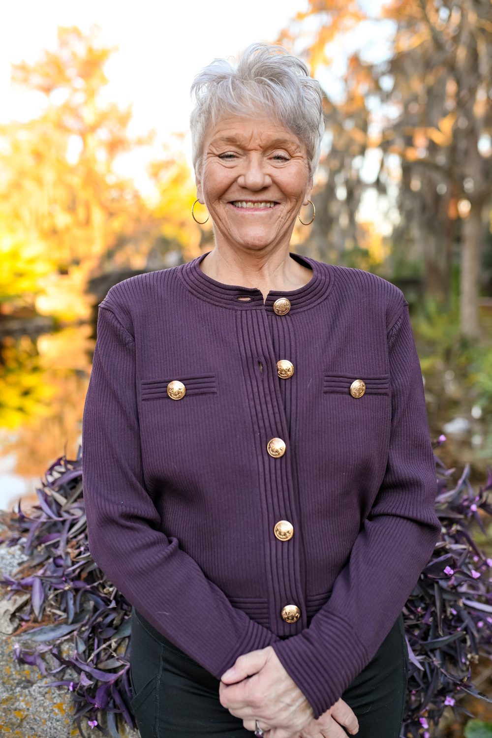 Linda Williams outdoors beneath live oaks